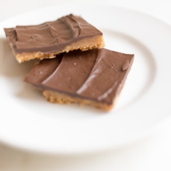 Christmas crack saltine coffee cut into squares on a white plate