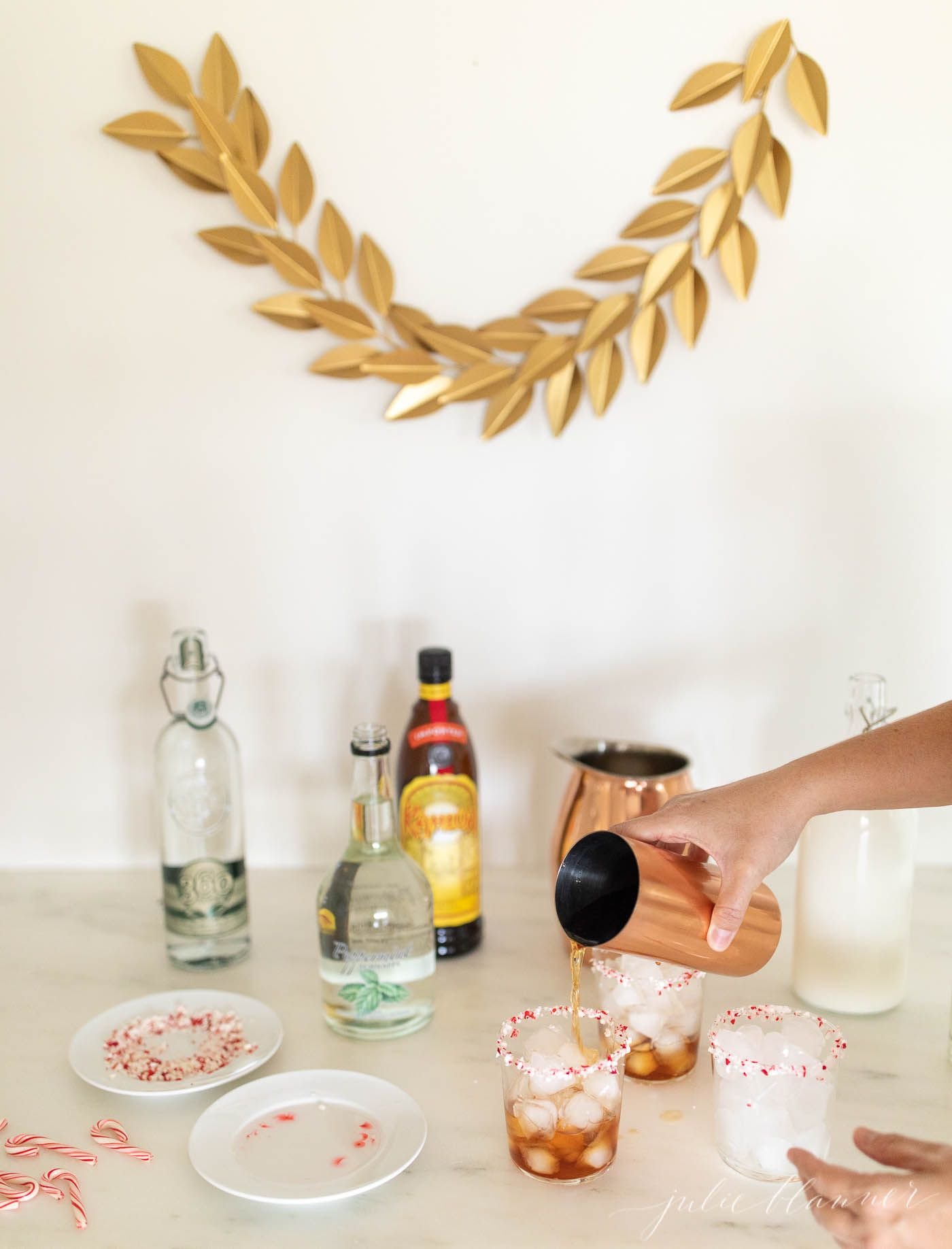 A bar set up for the holidays with ingredients for a Peppermint White Russian Cocktail.