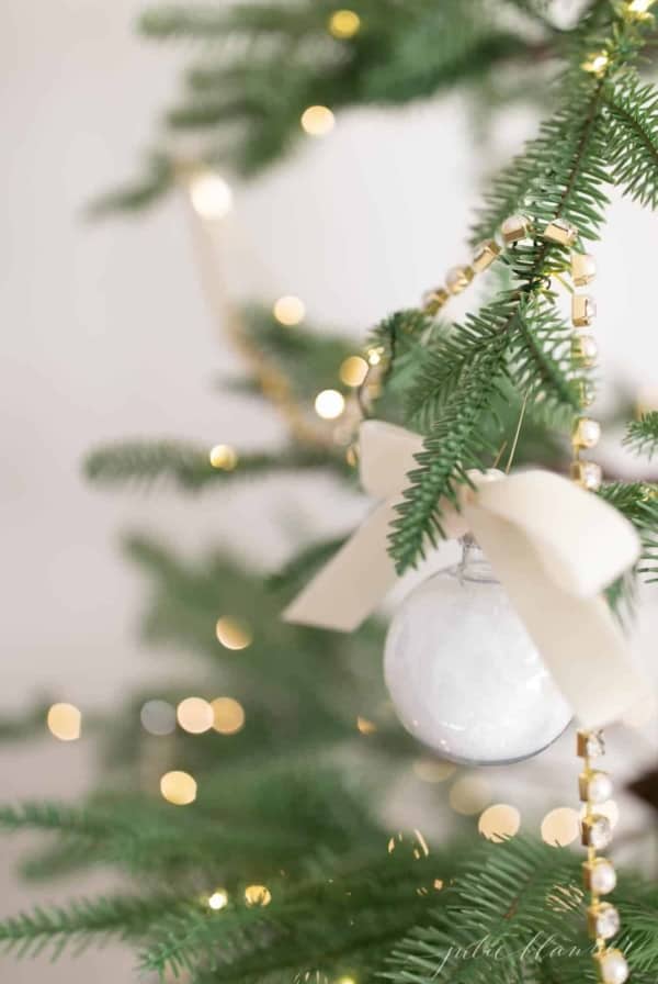 bath salt ornament hanging on tree with lights