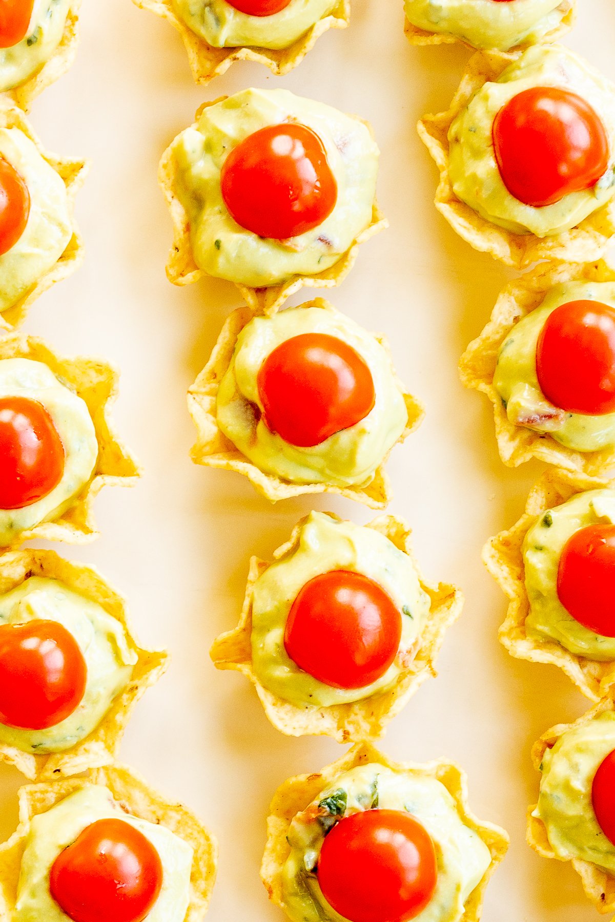 Guacamole bites on a white plate.