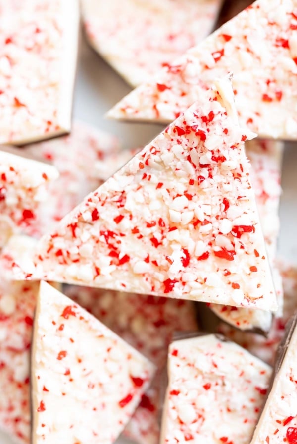 Peppermint bark with white and red sprinkles enhanced with peppermint extract.