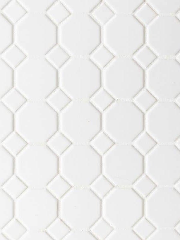 White hexagon tile floor, white grout.