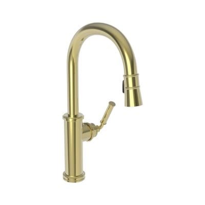 An unlacquered brass kitchen faucet against a white background.