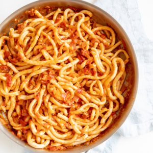 bucatini all'amatriciana in a skillet.