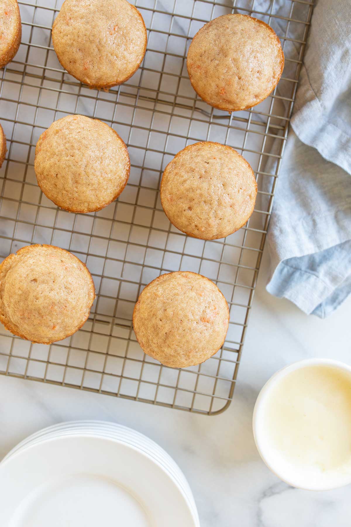 Carrot Cake Muffins on a cooling rack.