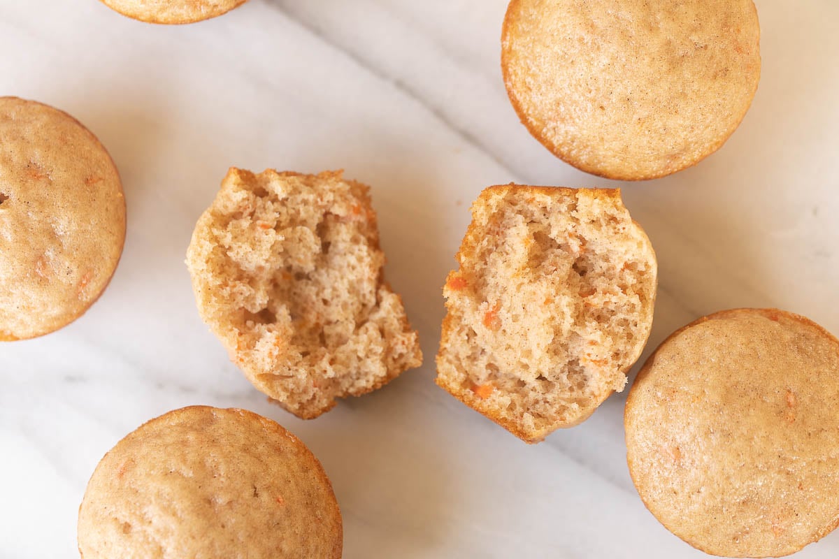 Carrot Cake Muffins with a bite taken out of them.