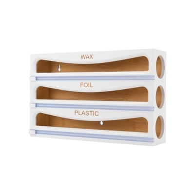 A white shelf with a plastic holder for kitchen drawer dividers and a wax holder.