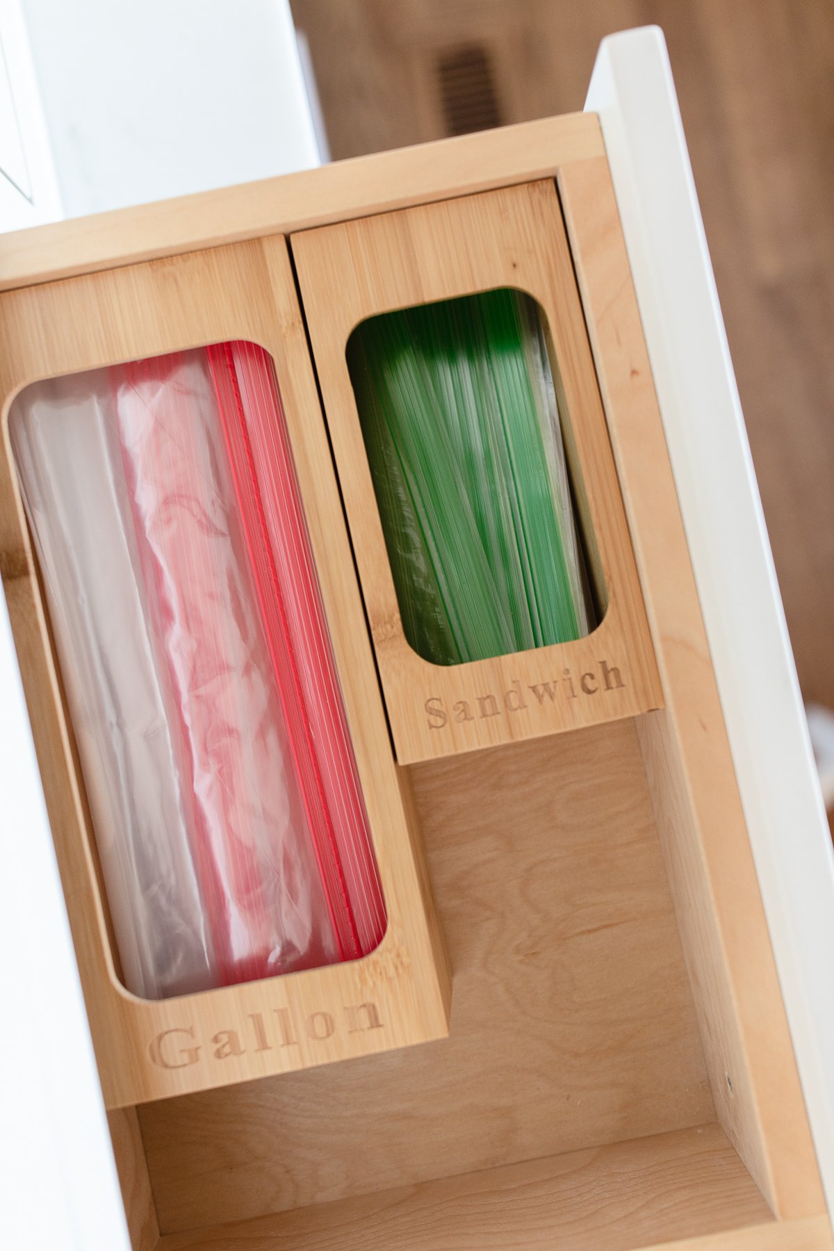A wooden cabinet with green and red container.