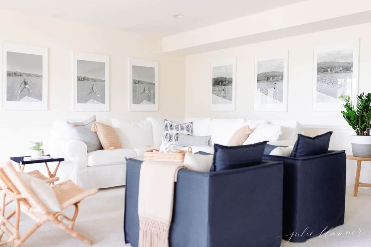 living room painted with cream paint color accented with rattan navy and white chairs