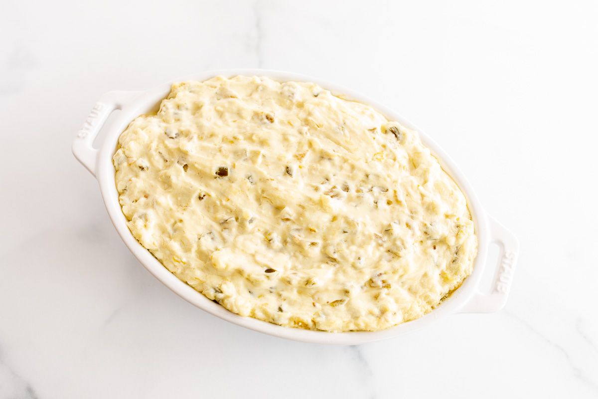 Creamy jalapeno dip on a marble countertop.