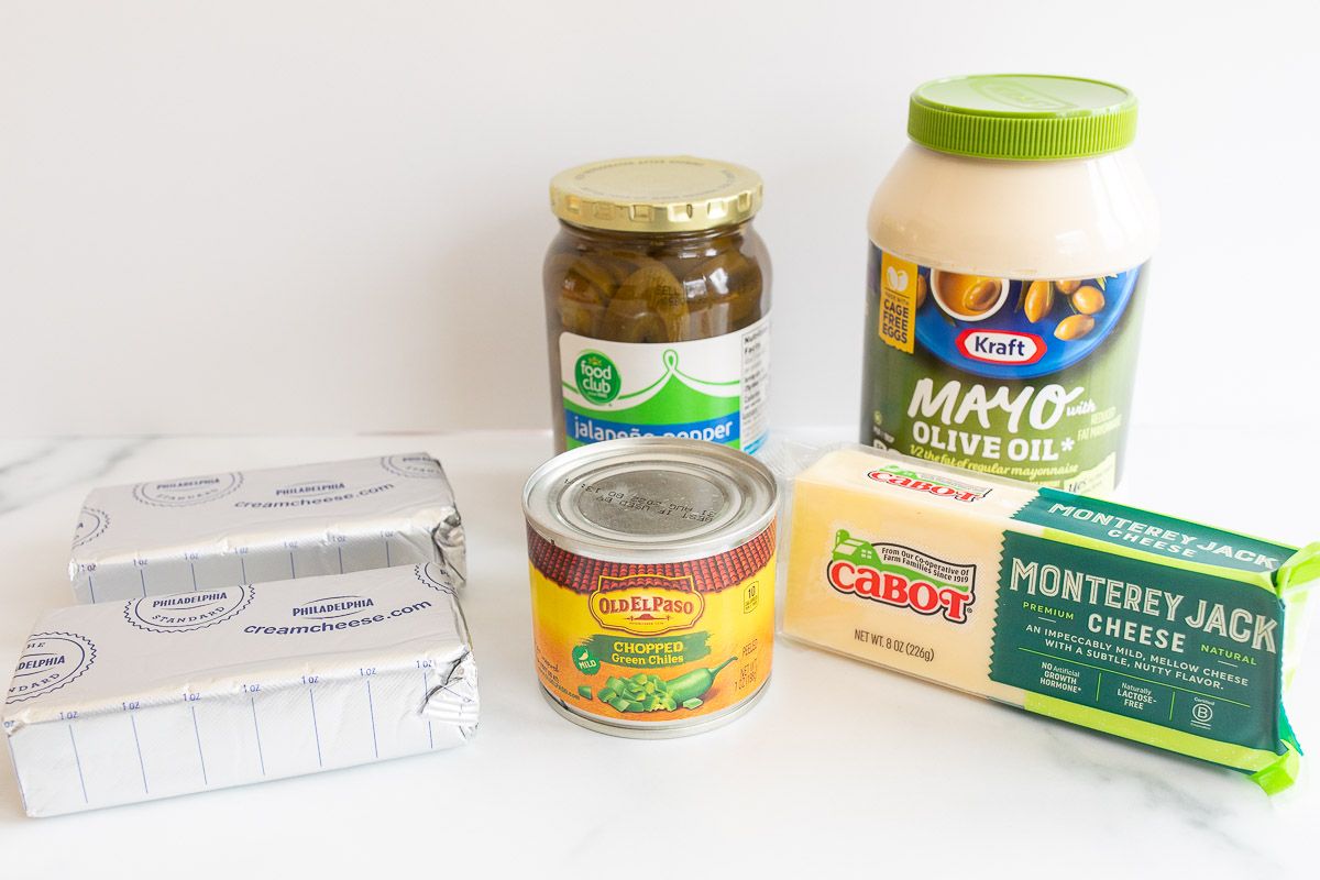 ingredients for jalapeno dip on a white surface.