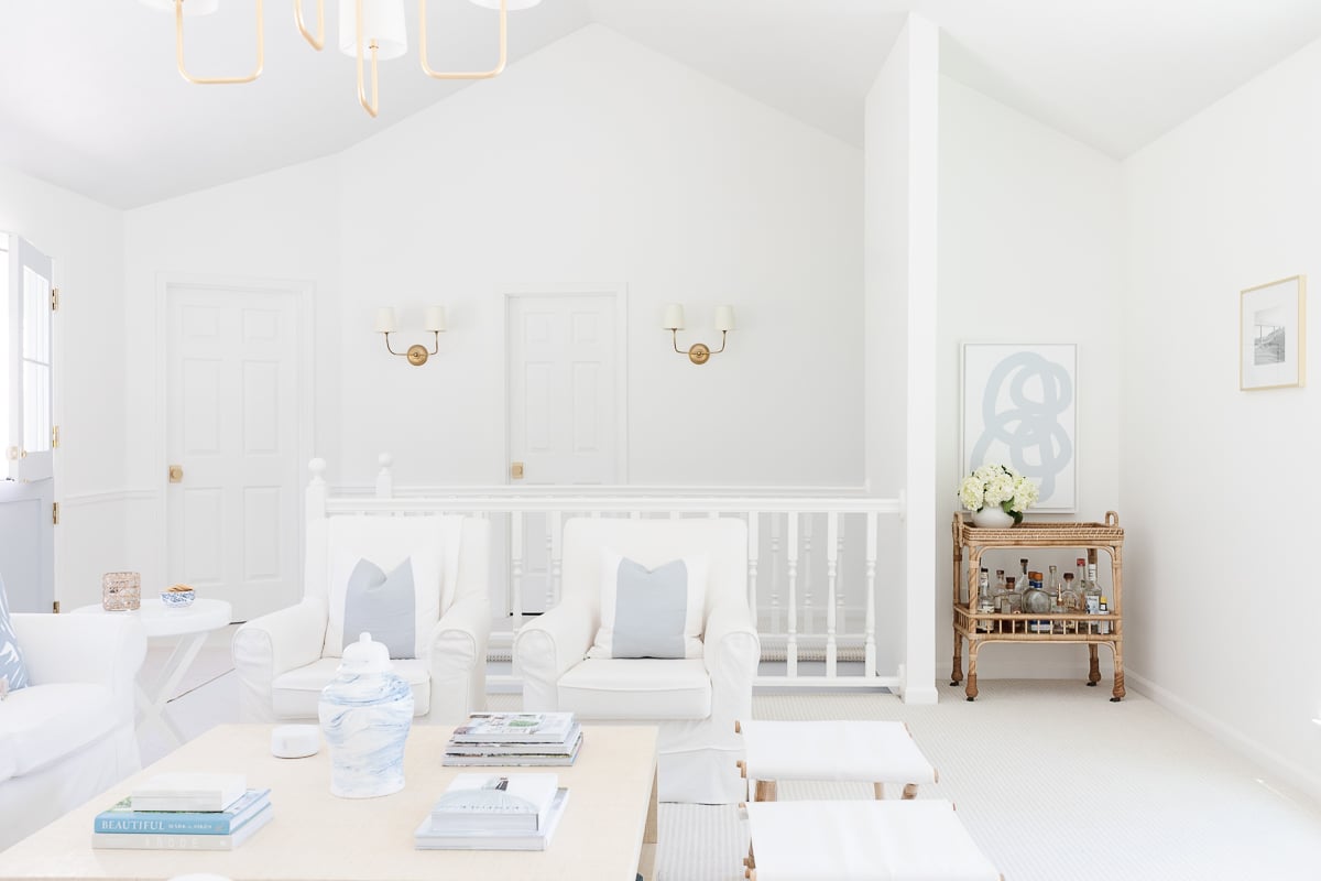 A white living room with white furniture for a vacation vibe at home.