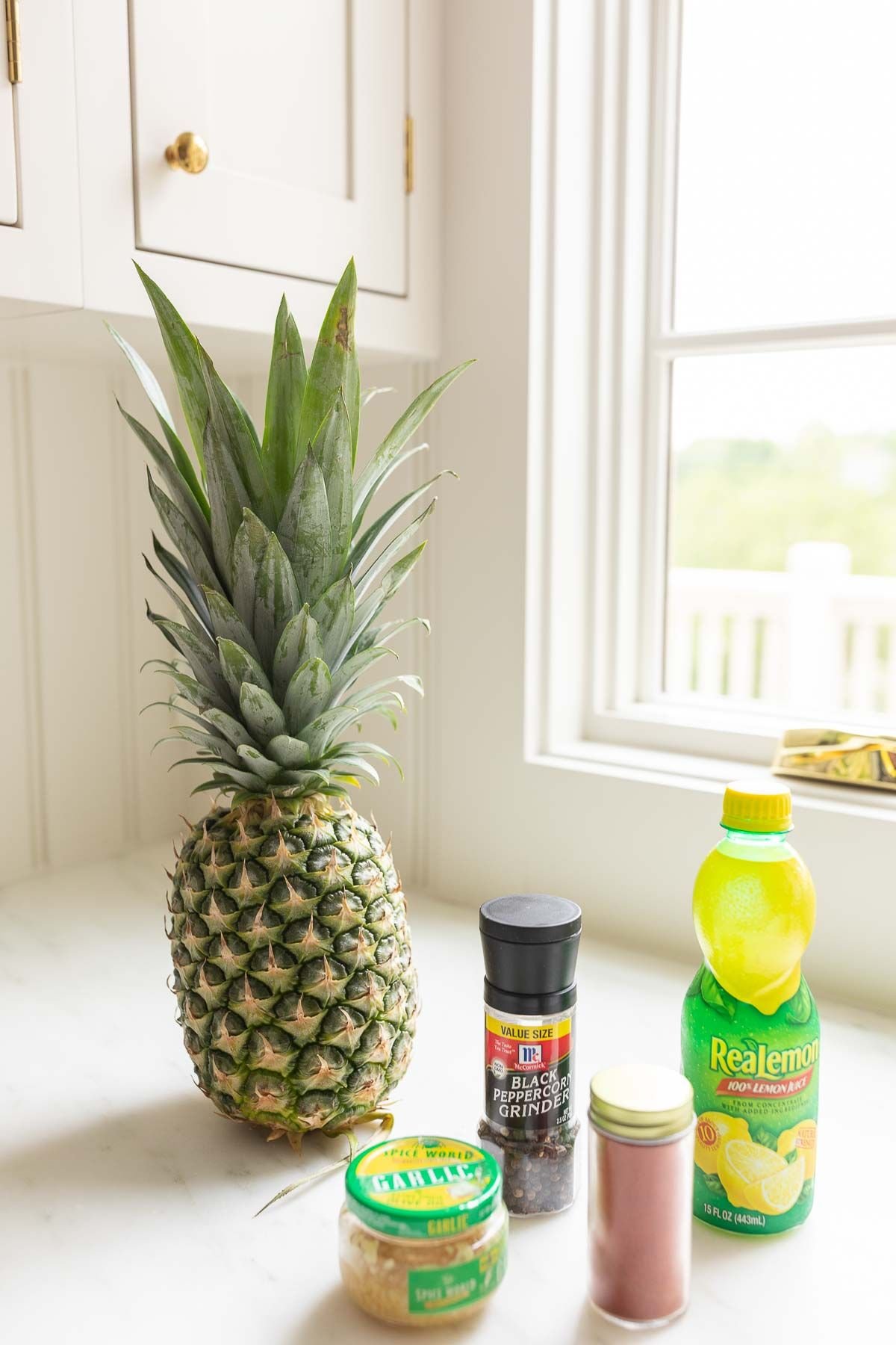 ingredients for a chicken kabob marinade on a white kitchen counter