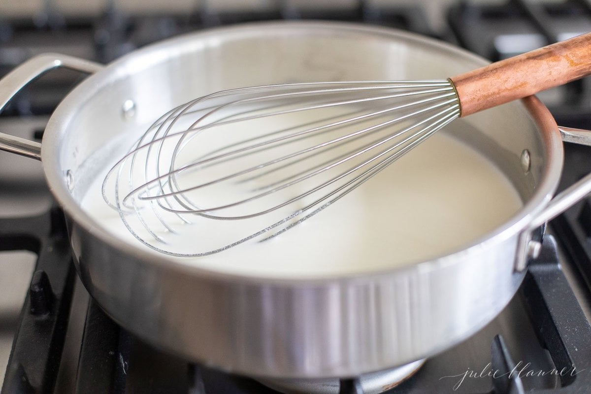 A stainless steel pan filled with a white wine lemon caper sauce.