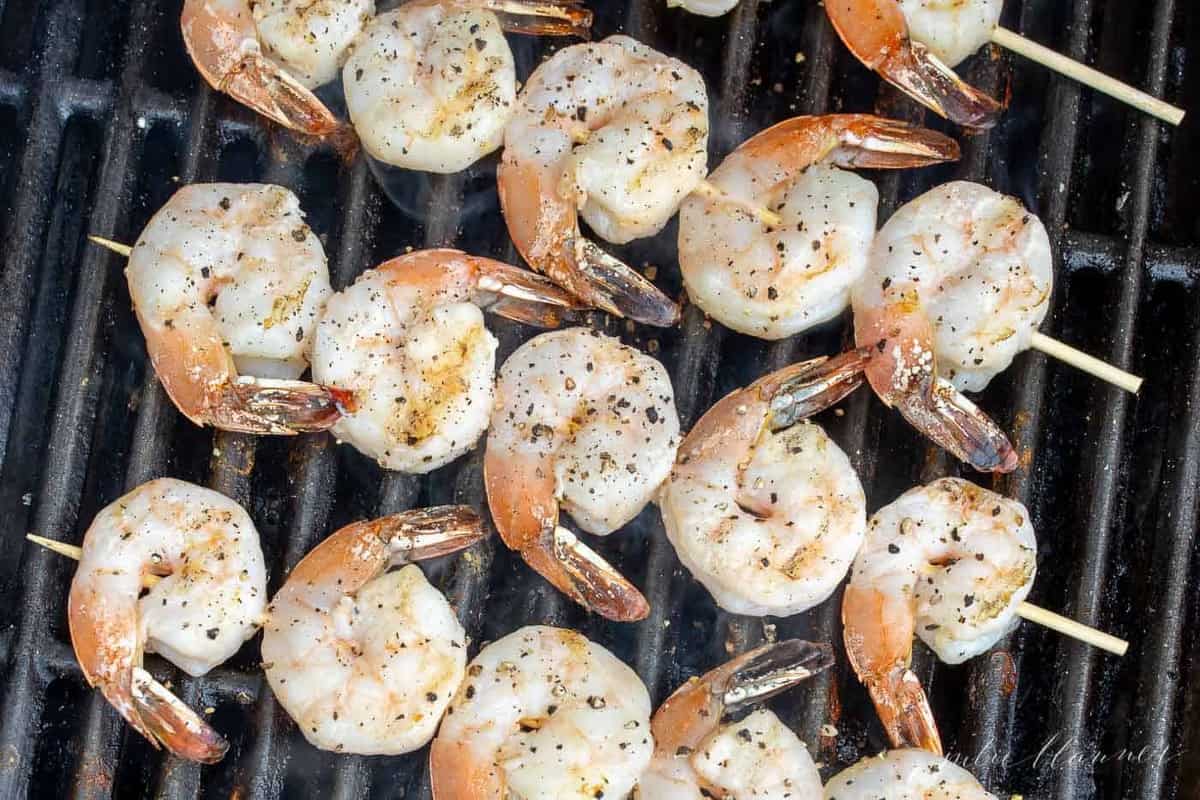 Lemon garlic shrimp kabobs on bamboo skewers on the grill.