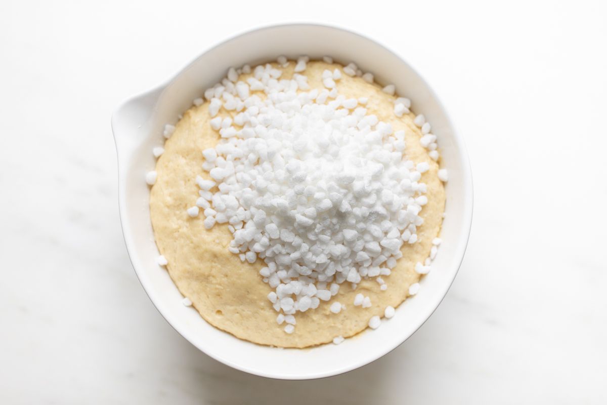 Belgian waffle recipe dough ingredients in a mixing bowl.