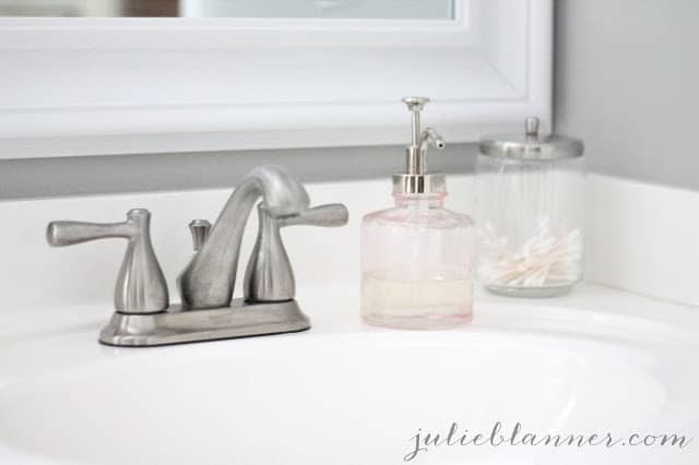 A counter with a sink and a mirror