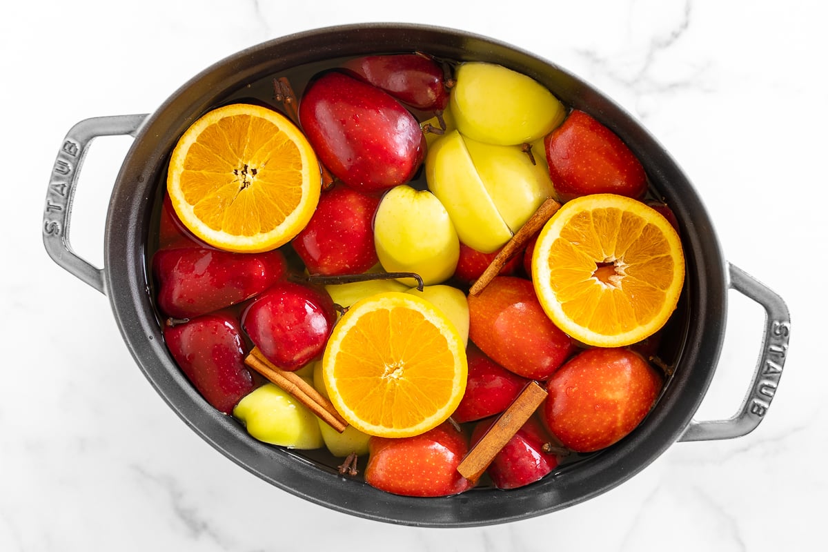 a cast iron Dutch oven filled with homemade apple cider.