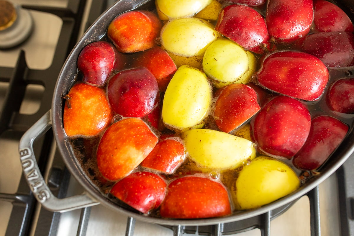 a cast iron Dutch oven filled with homemade apple cider.