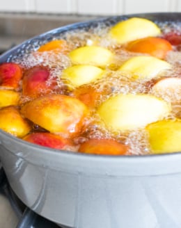 a cast iron Dutch oven filled with homemade apple cider.