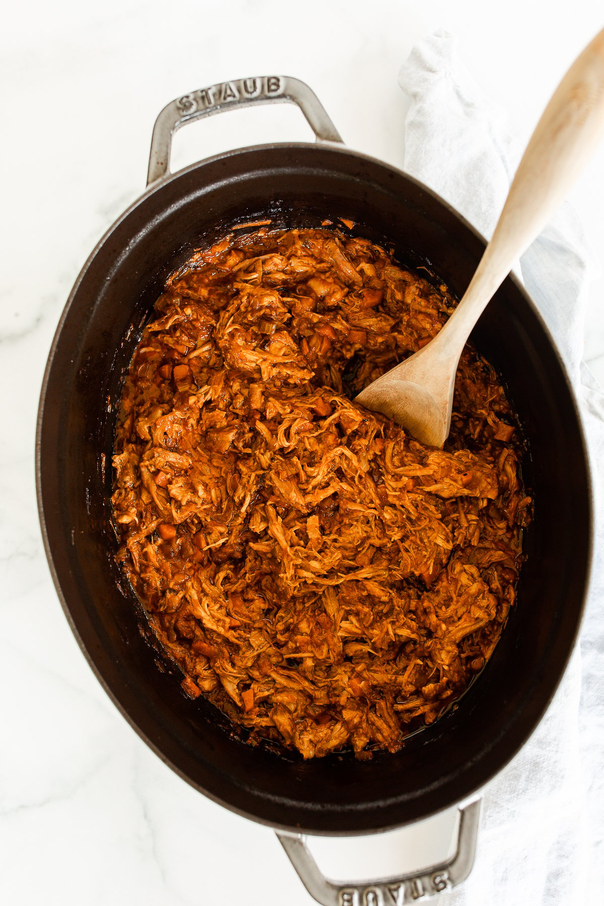 Pork ragu in a cast iron pot.