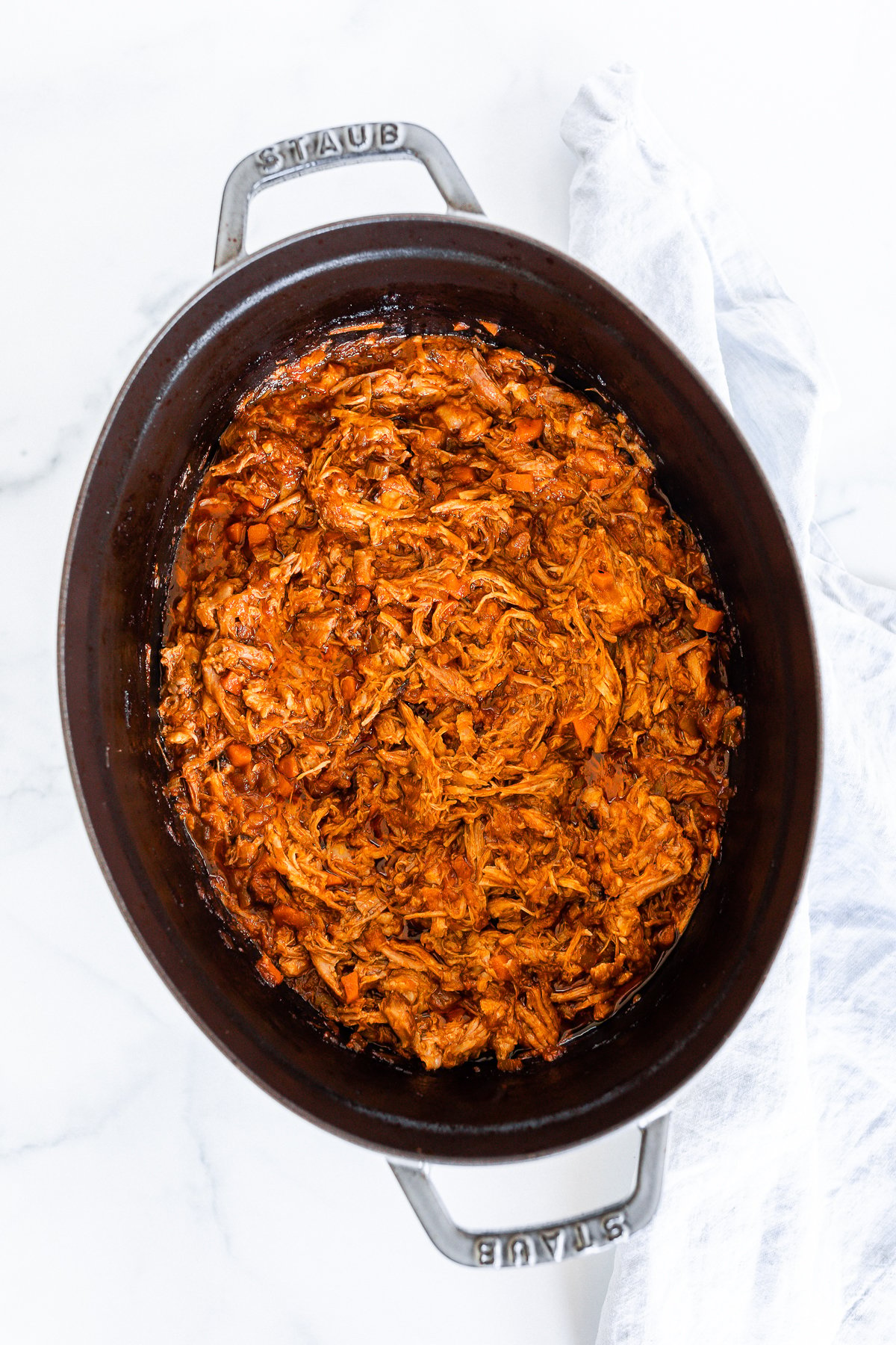 Pork ragu in a cast iron pot.