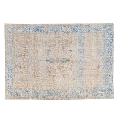 A vintage Turkish rug on a white background.