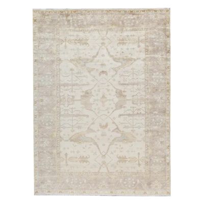 A vintage Turkish rug on a white background.