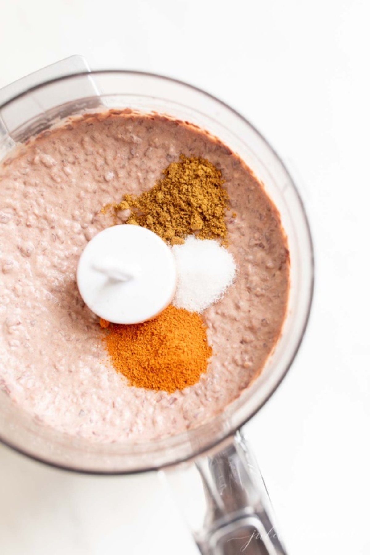 Black bean hummus ingredients inside a food processor.