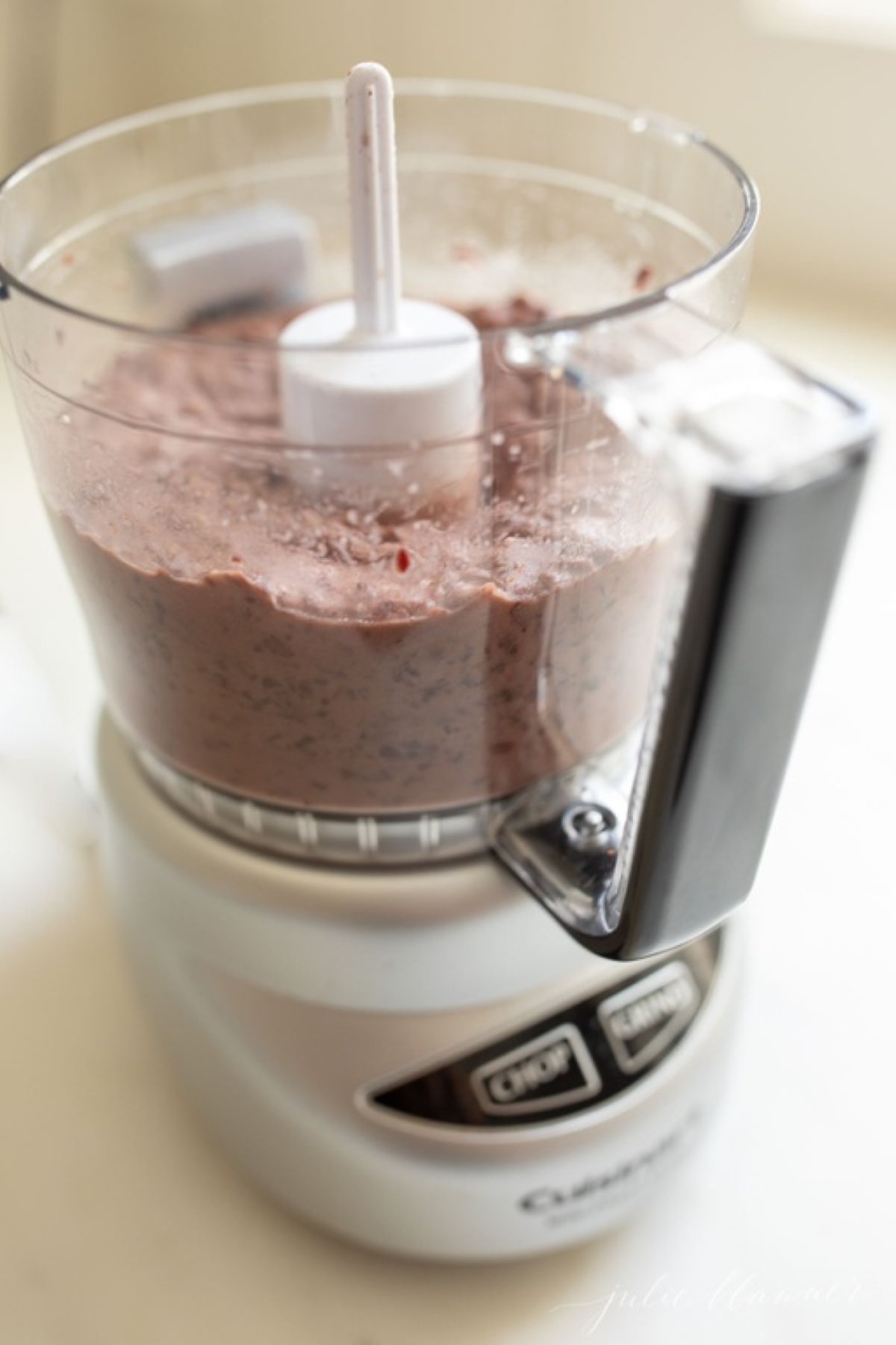 Black bean hummus inside a food processor.