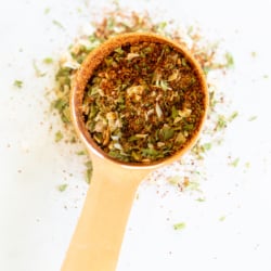 Homemade fiesta ranch seasoning in a copper measuring spoon.