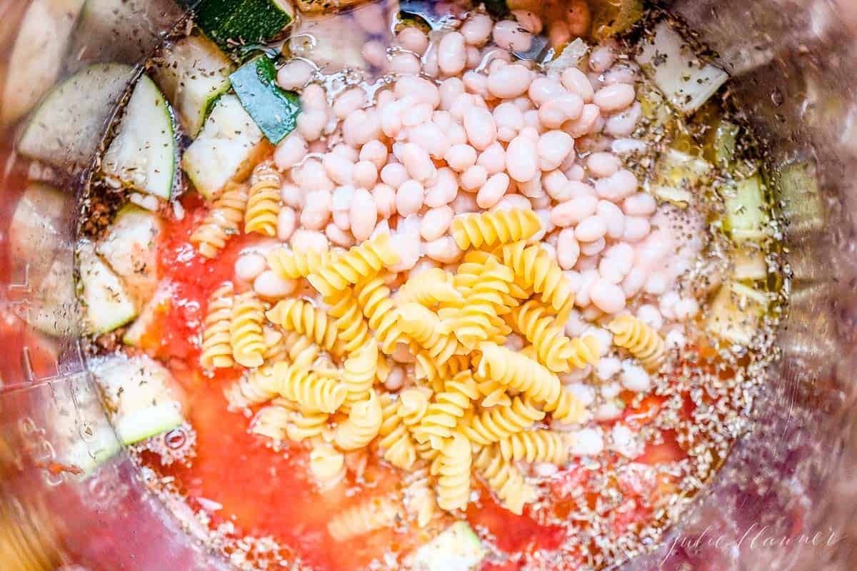 Looking into a pot full of a minestrone soup recipe.