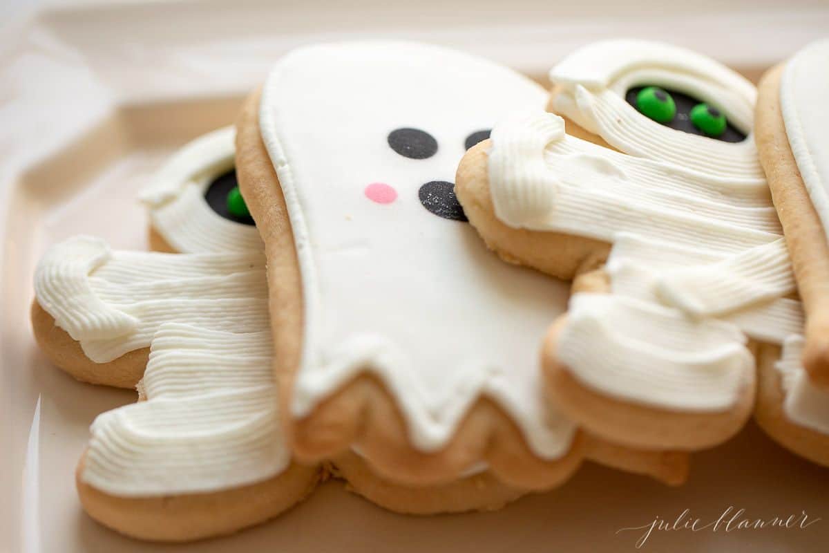 White decorated ghost and mummy sugar cookies.