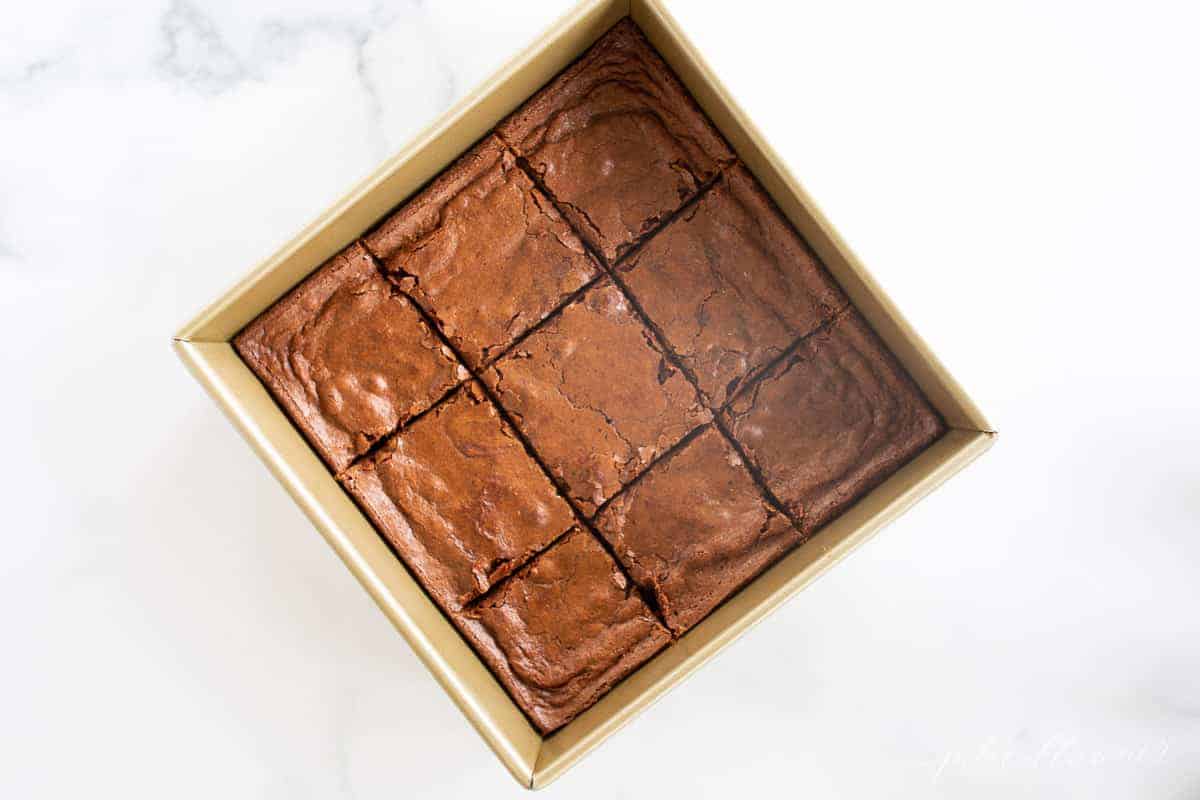 brownies cut in gold baking pan