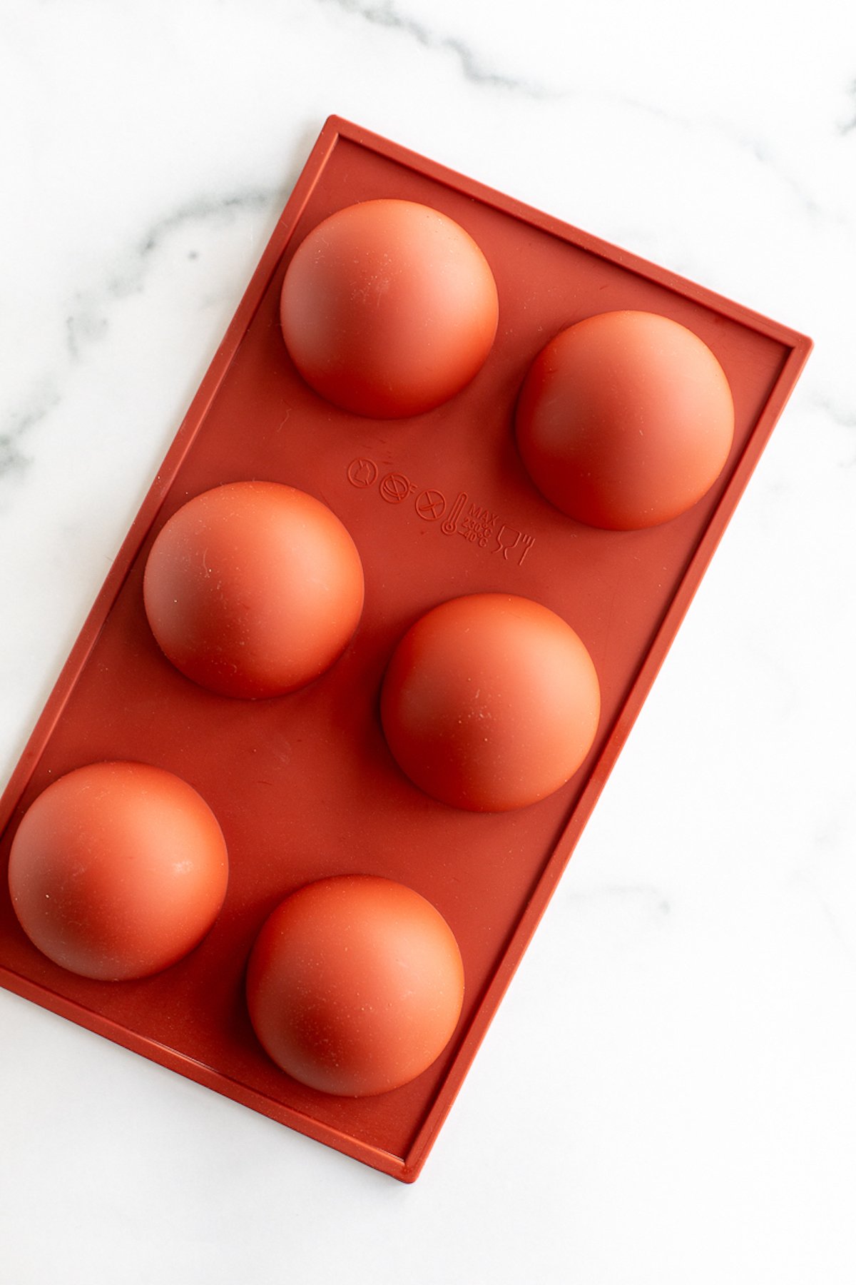 A red hot chocolate bomb mold