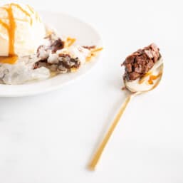 bite of phyllo covered brownie on gold spoon