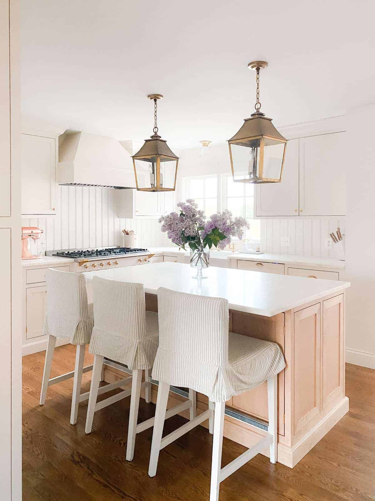 brass lanterns over kitchen island