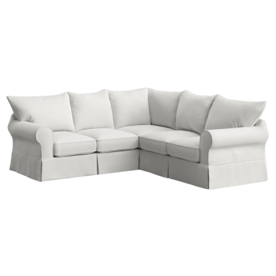 A white sectional sofa against a white background.