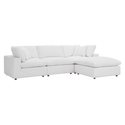 A white sectional sofa against a white background.