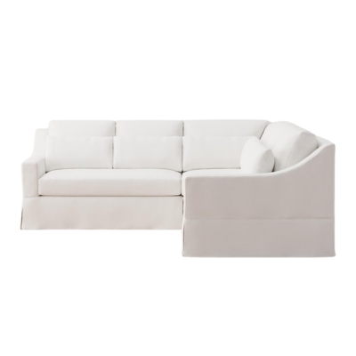 A white sectional sofa against a white background.