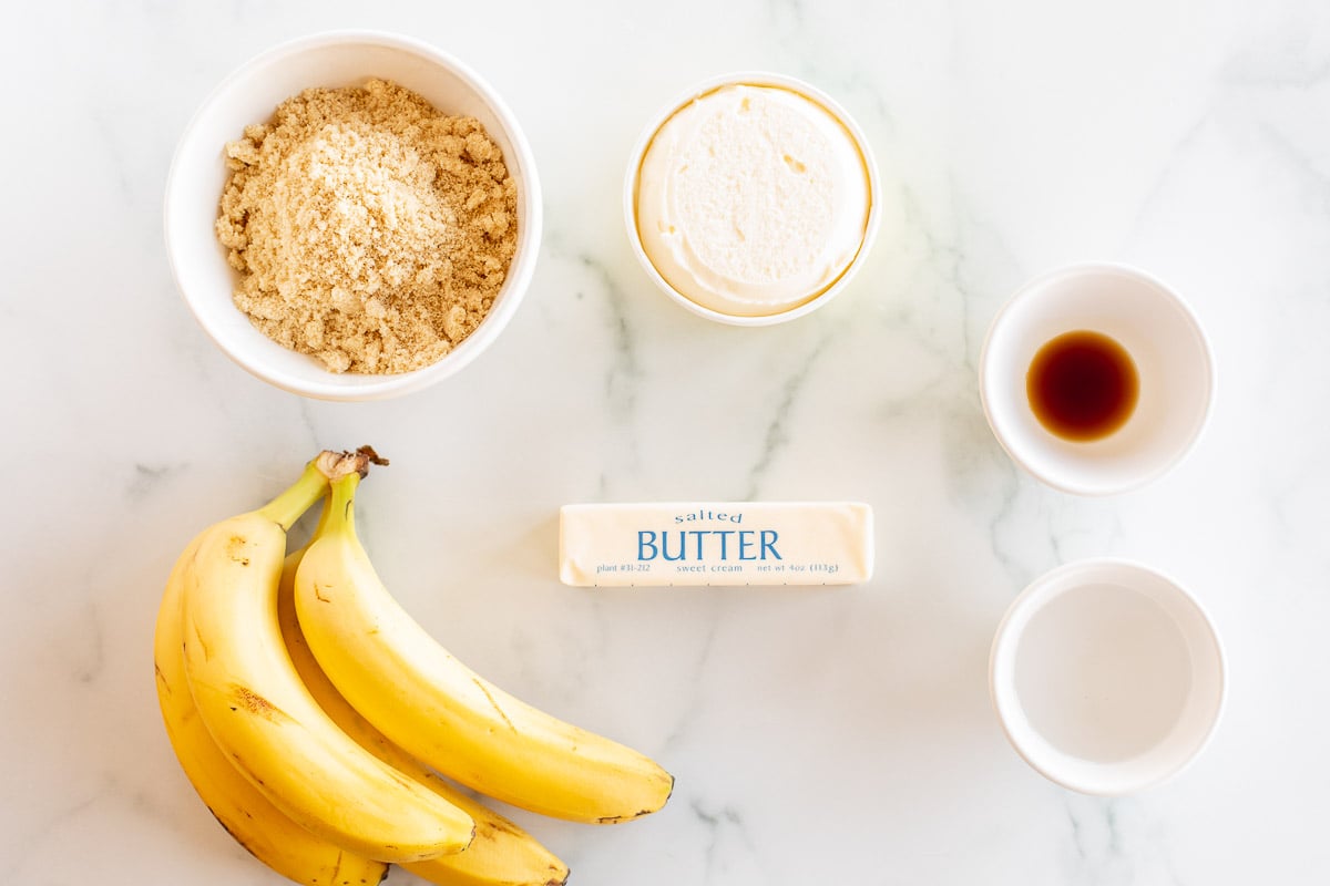 Bananas Foster, a mouthwatering dessert made with bananas, butter, and sugar on a marble table.