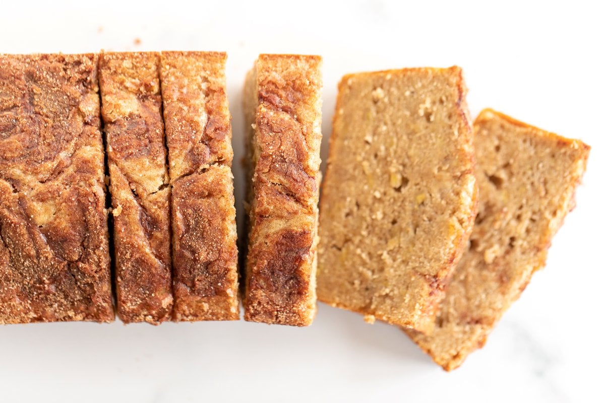 Banana bread with no baking soda or baking powder laid out on a white plate.