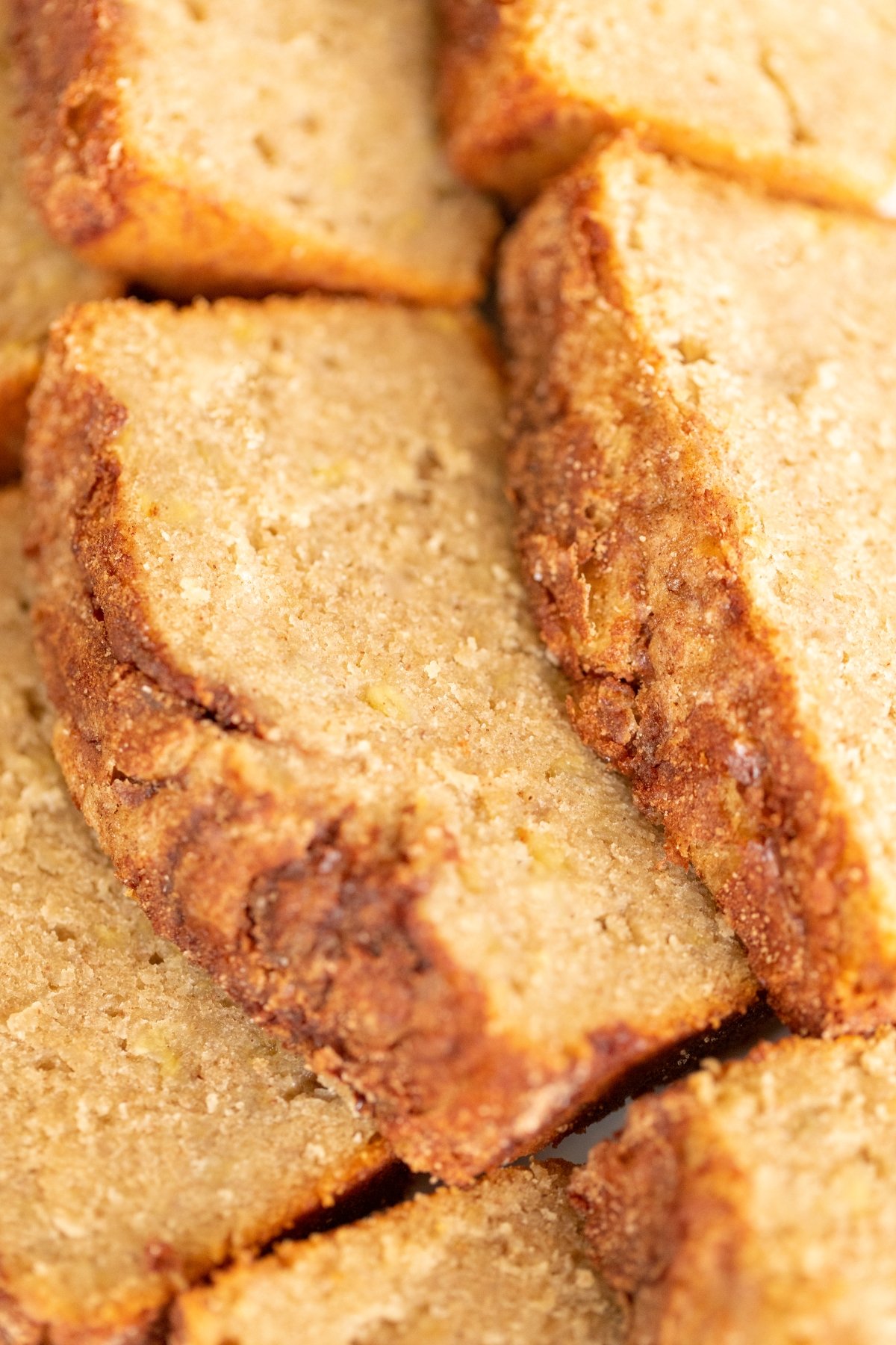 Banana bread with no baking soda or baking powder laid out on a white plate.