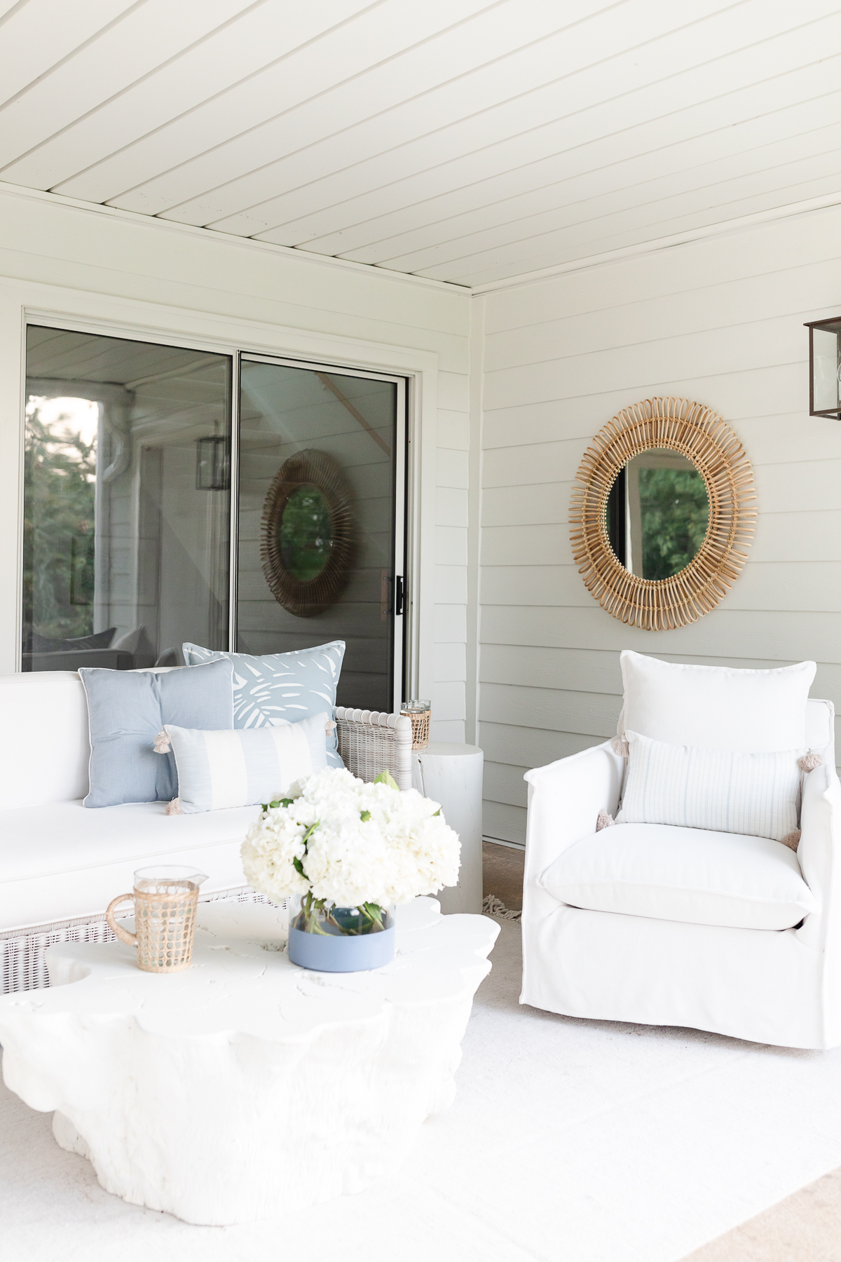 A white living room with a white coffee table.