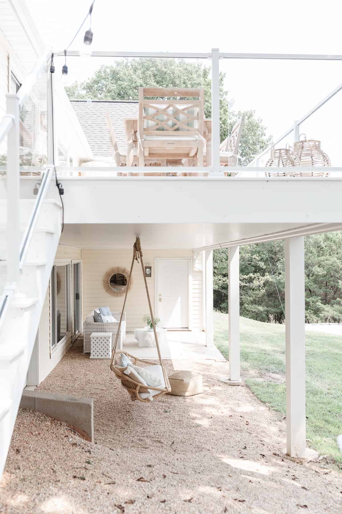 white deck with coastal outdoor furniture and swing