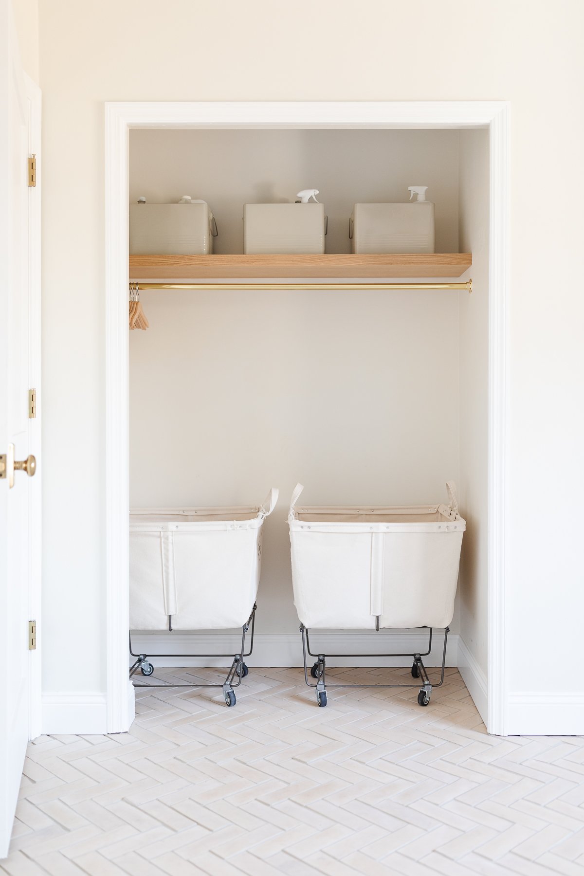 Strategically organize two laundry baskets in a room with a door for optimal laundry room organization.