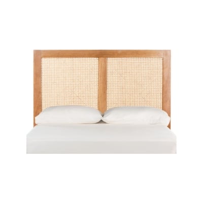 A wooden headboard with a woven rattan headboard.