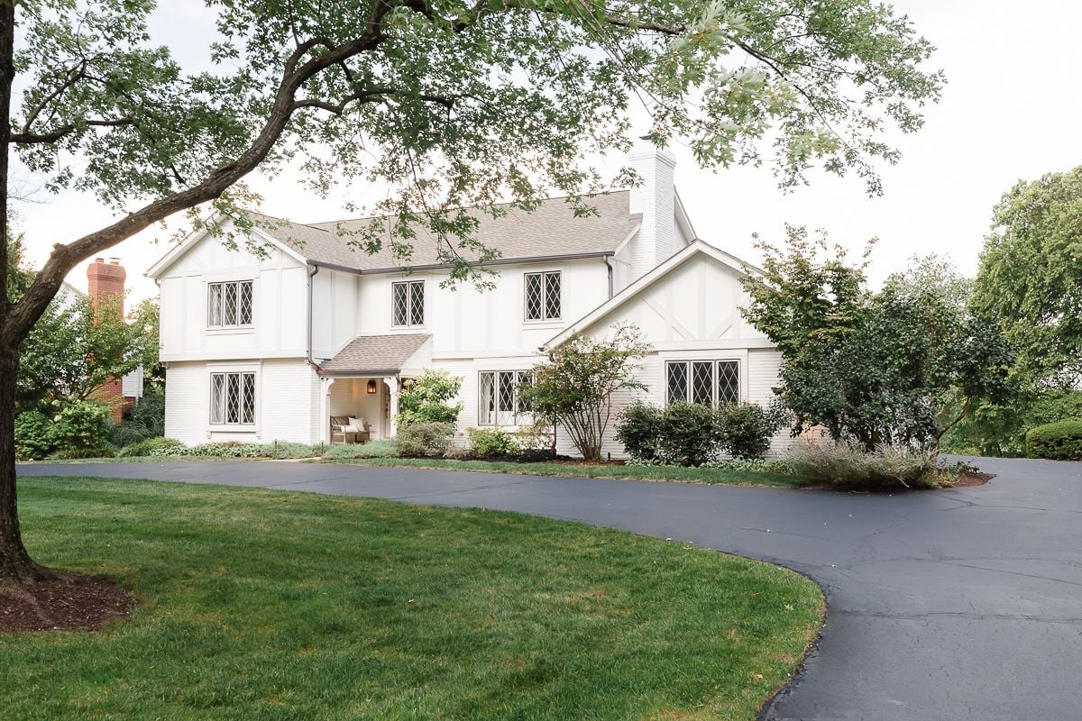 A vintage 70s tudor home, with soft cream and greige tudor paint colors.