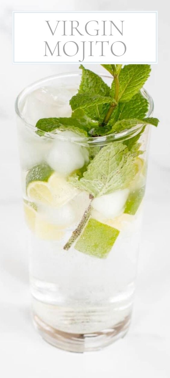 A clear glass full of a non alcoholic mojito recipe on a marble surface.