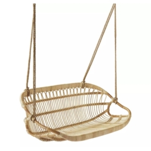 A lake house decor  rattan swing chair with a wooden frame.